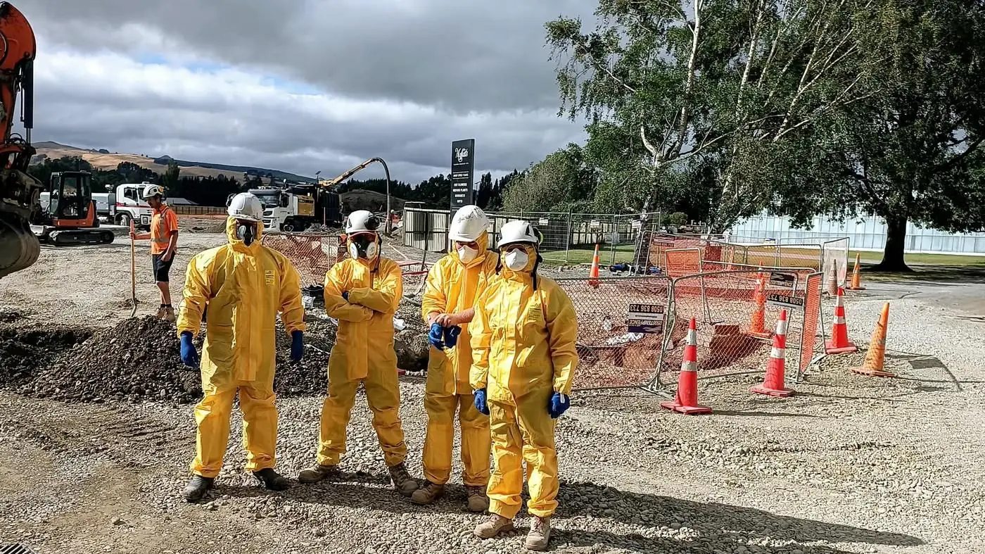 Field team in protective equipment on an infrastructure site
